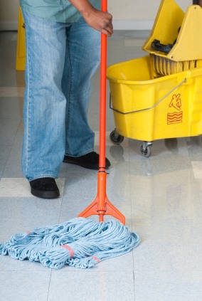 CKS Cleaning Services, Inc. janitor in Wesley Chapel, NC mopping floor.